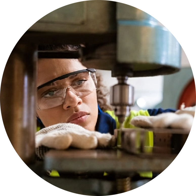 woman working drill press